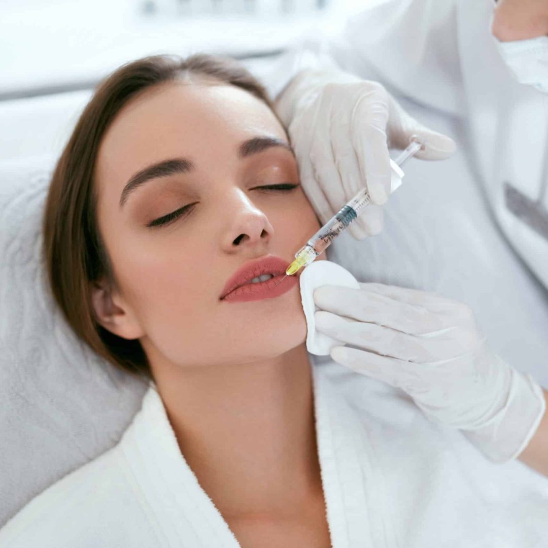 Lip Augmentation. Woman Getting Beauty Injection For Lips Lip Augmentation. Woman Getting Beauty Injection For Lips, Facial Beauty Procedure. High Resolution