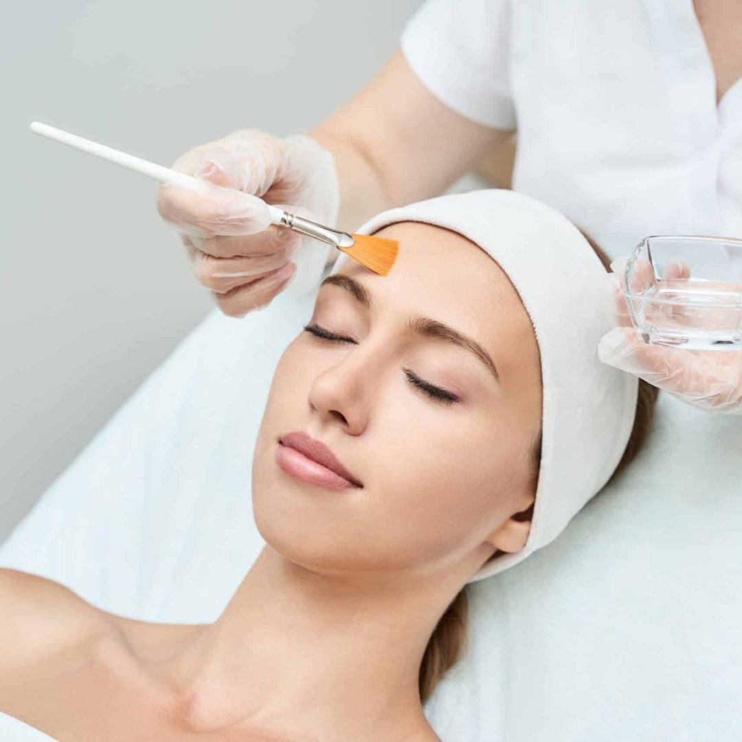 Cosmetology beauty procedure. Young woman skin care. Cosmetology beauty procedure. Young woman skin care. Beautiful female person. Rejuvenation treatment. Facial chemical peel therapy. Clinical healthcare. Doctor hand. Dermatology cleanser.